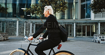Buy stock photo Bicycle, corporate and mature businesswoman in city with travel, journey or trip to office building. Commute, bike and professional female executive with eco friendly transport to work in urban town.