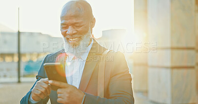 Buy stock photo Phone, happy and businessman in city with communication, social networking or connectivity online. Travel, cellphone and African male lawyer with email for legal case information on commute in town.