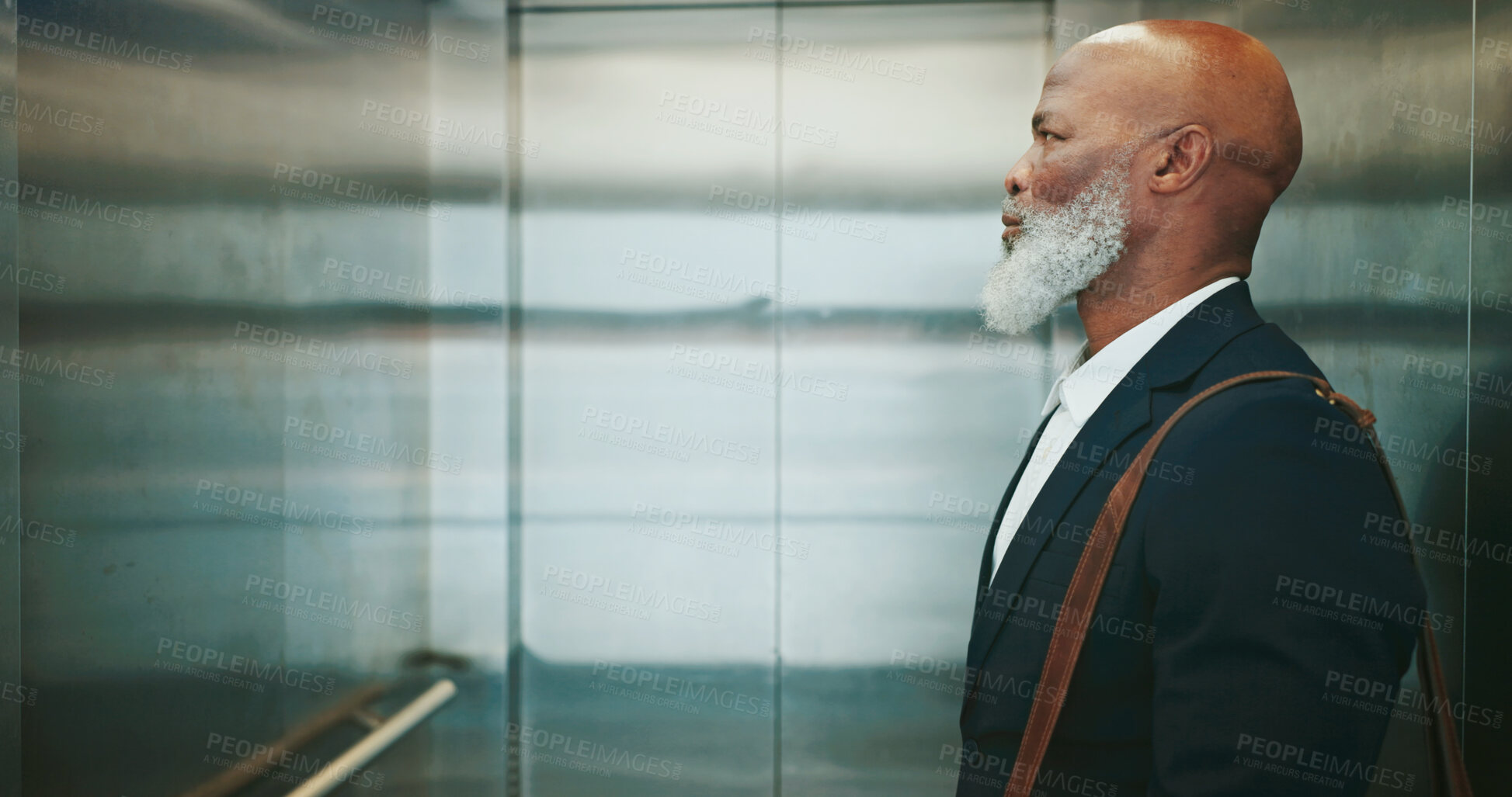 Buy stock photo Business, man and travel in office elevator for morning commute, journey to work or waiting to exit. Mature professional, black employee and bag in lift for leaving building, company floor or arrival