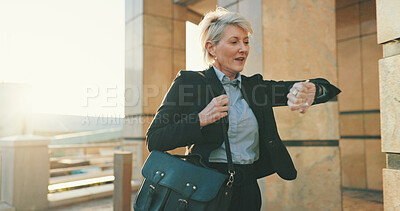 Buy stock photo Stress, watch and business woman with running in city for urgent meeting, rushing to appointment or late. Mature professional, panic or schedule mistake for morning commute or time management outdoor