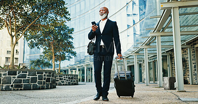 Buy stock photo Phone, businessman thinking and travel with suitcase in city for idea, booking flight or planning trip schedule. Luggage, walking or mature African person with mobile at building, hotel and commute