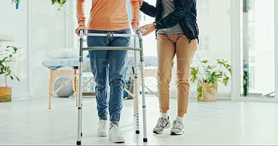 Buy stock photo Legs, physiotherapist and walker for patient, support or help for recovery, steps or guide at hospital. Doctor, frame and person with disability for rehabilitation, balance or feet at wellness clinic