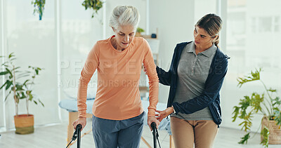 Buy stock photo Senior woman, physiotherapist and walker for recovery, help hand and support for progress, steps and guide at hospital. Doctor, frame and person with disability, rehabilitation and balance at clinic