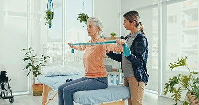 Buy stock photo Senior woman, physiotherapist and resistance band for stretching, recovery or support at hospital. Doctor, exercise and elderly patient with progress, guide and rehabilitation for injury at clinic
