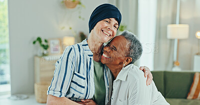 Buy stock photo Senior women, happy and hug with cancer, recovery and excited with reunion, care and bonding in retirement. People, embrace and smile with connection, remission and together in lounge at nursing home