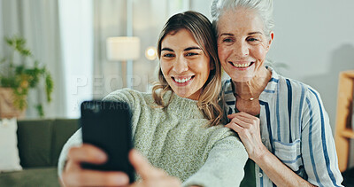Buy stock photo Woman, senior mom and selfie in house for memory, hug and care with bonding for post on mobile app. People, mother and daughter with profile picture, photography and social network in family home