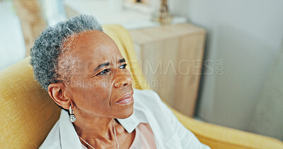 Buy stock photo Thinking, sad and elderly black woman in home with depression, nostalgia and reflection in living room. Sofa, retirement and senior person with thoughtful, memory and mourning expression in house