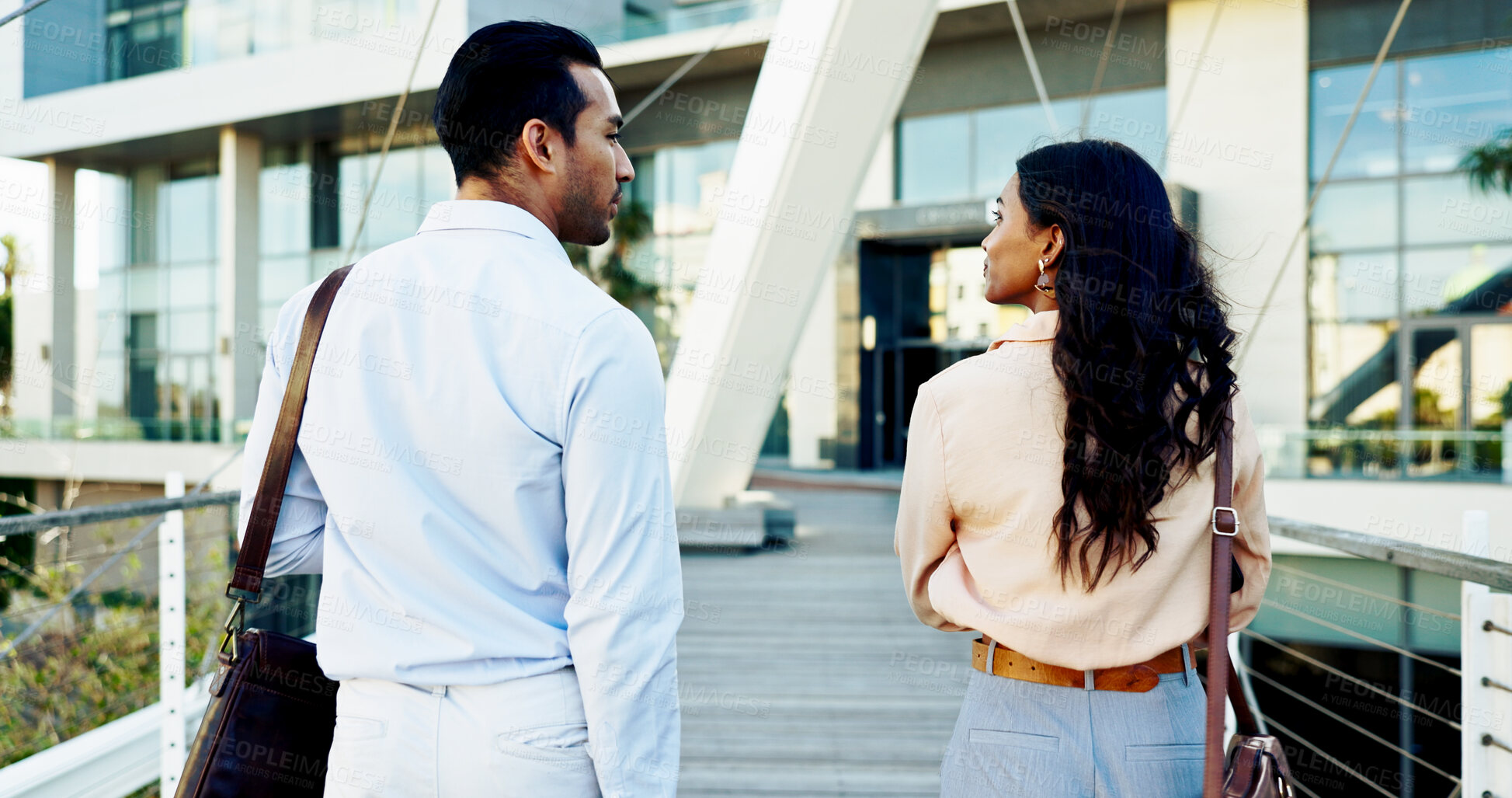 Buy stock photo Outdoor, business people and walking to office with conversation, networking or commuting in city. Back view, employee and coworkers with talking or ready to start work in urban town as professionals
