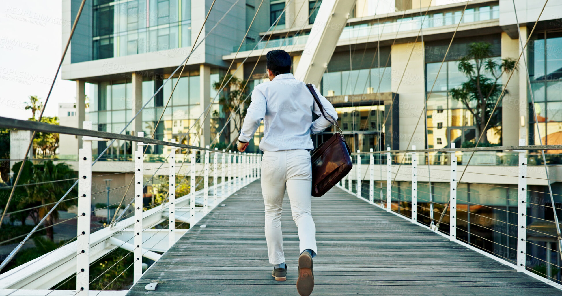 Buy stock photo Running late, city and back with man, business and movement on bridge, travel and corporate professional. Outdoor, person and employee with speed, delay and appointment with urban town or buildings