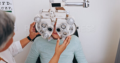 Buy stock photo Doctor, optometry and woman on phoropter for vision, consultation and hands in clinic for health exam. Ophthalmologist, test and patient on machine for eye care, wellness and eyesight correction