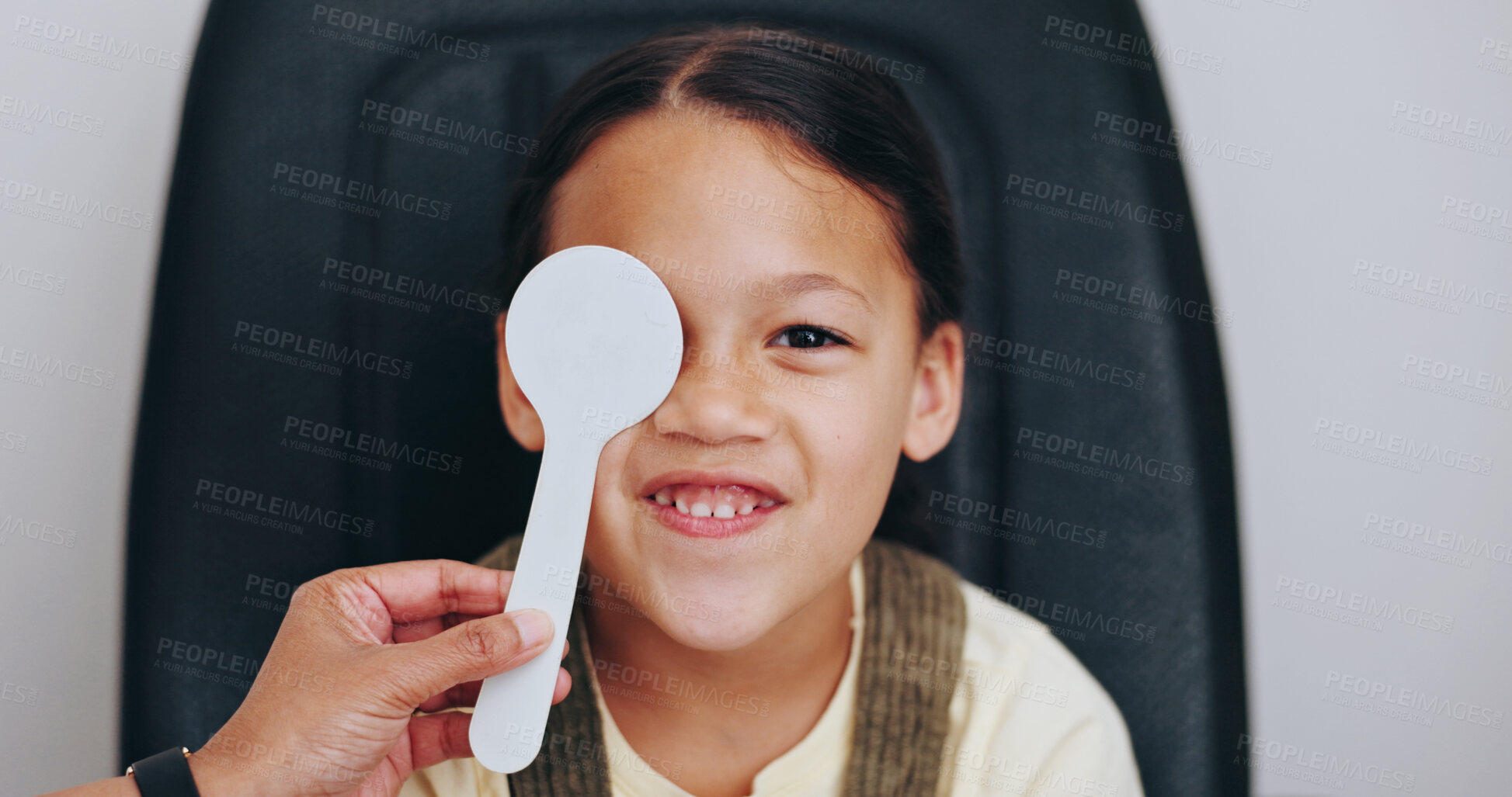 Buy stock photo Hand, cover or child in eye test at optometry clinic for eyewear, treatment or sight wellness. Portrait, occluder or happy girl kid in assessment for optical diagnosis, vision exam and consultation