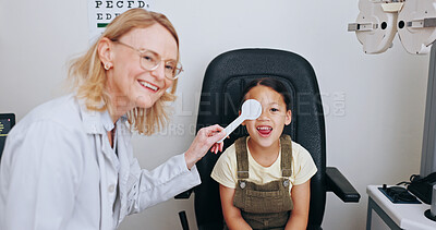 Buy stock photo Doctor, occluder or kid in eye test at optometry clinic for eyewear, health or sight wellness. Tools, smile or happy child in assessment for optical diagnosis, vision exam or spectacles with object