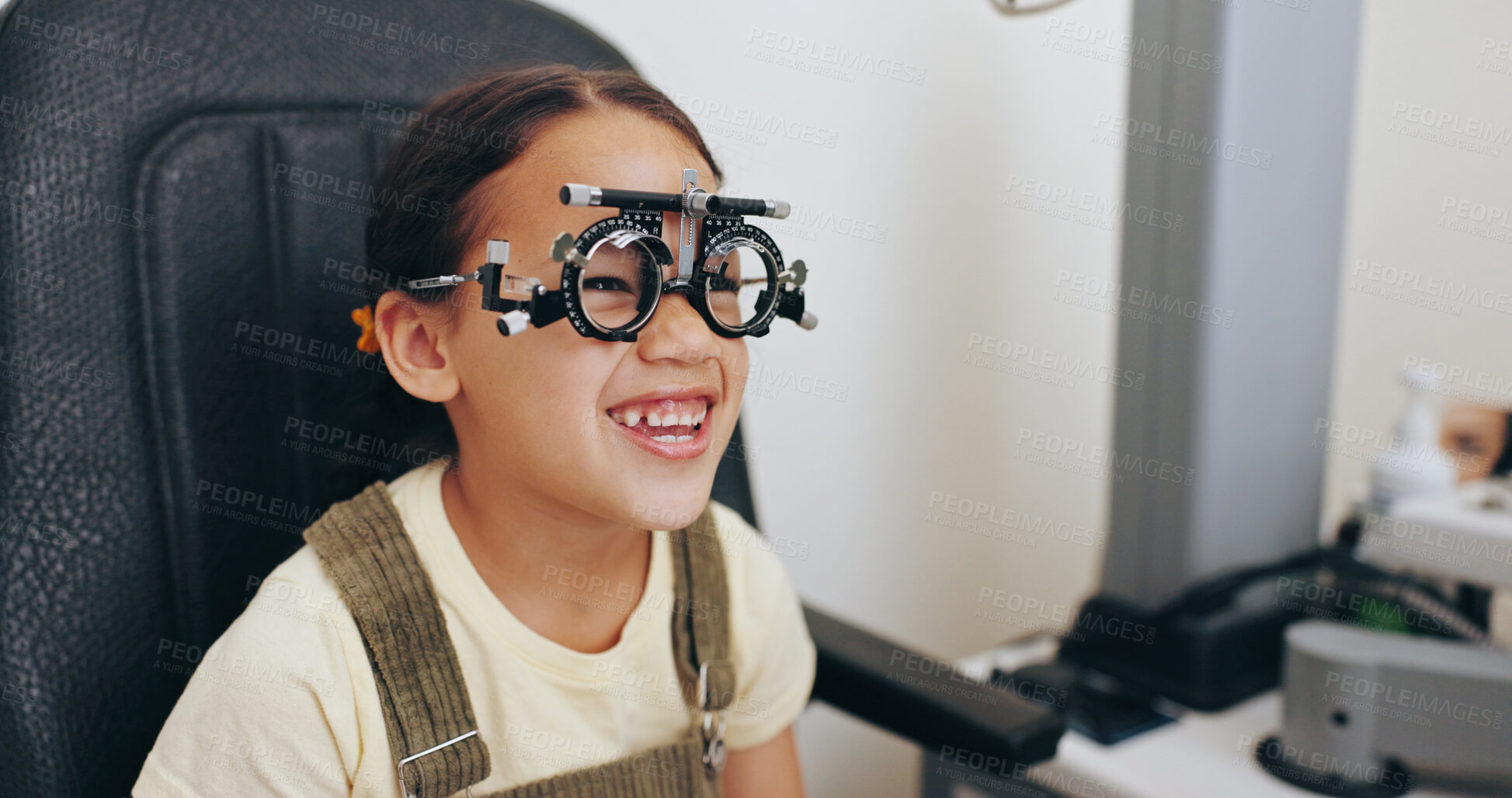 Buy stock photo Trial frame, smile or girl in eye test at optometry clinic for eyewear, retina health or sight wellness. Vision exam, excited or happy child in assessment for optical lenses, frames or spectacles