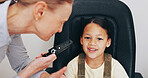 Doctor, laser or kid in eye test at optometry clinic for eyewear diagnosis and sight wellness. Retina, light tool and happy girl child in assessment for optical check, vision exam or consultation