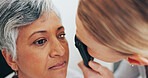 Optometrist, consulting and retinoscope with old woman in clinic for eye exam, healthcare and vision. Medical, ophthalmologist and glaucoma with people and tools for retina, test and assessment