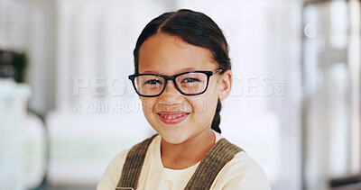 Buy stock photo Eye care, girl child and portrait with glasses in optometry store for prescription lens, optic correction or healthcare. Vision, kid or happy with new eyewear for medical service or health insurance