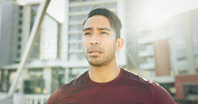 Buy stock photo Running, thinking and tired with man in city for cardio, marathon practice and workout. Health, competition training and fitness with male person in outdoor for reflection, exercise and sports