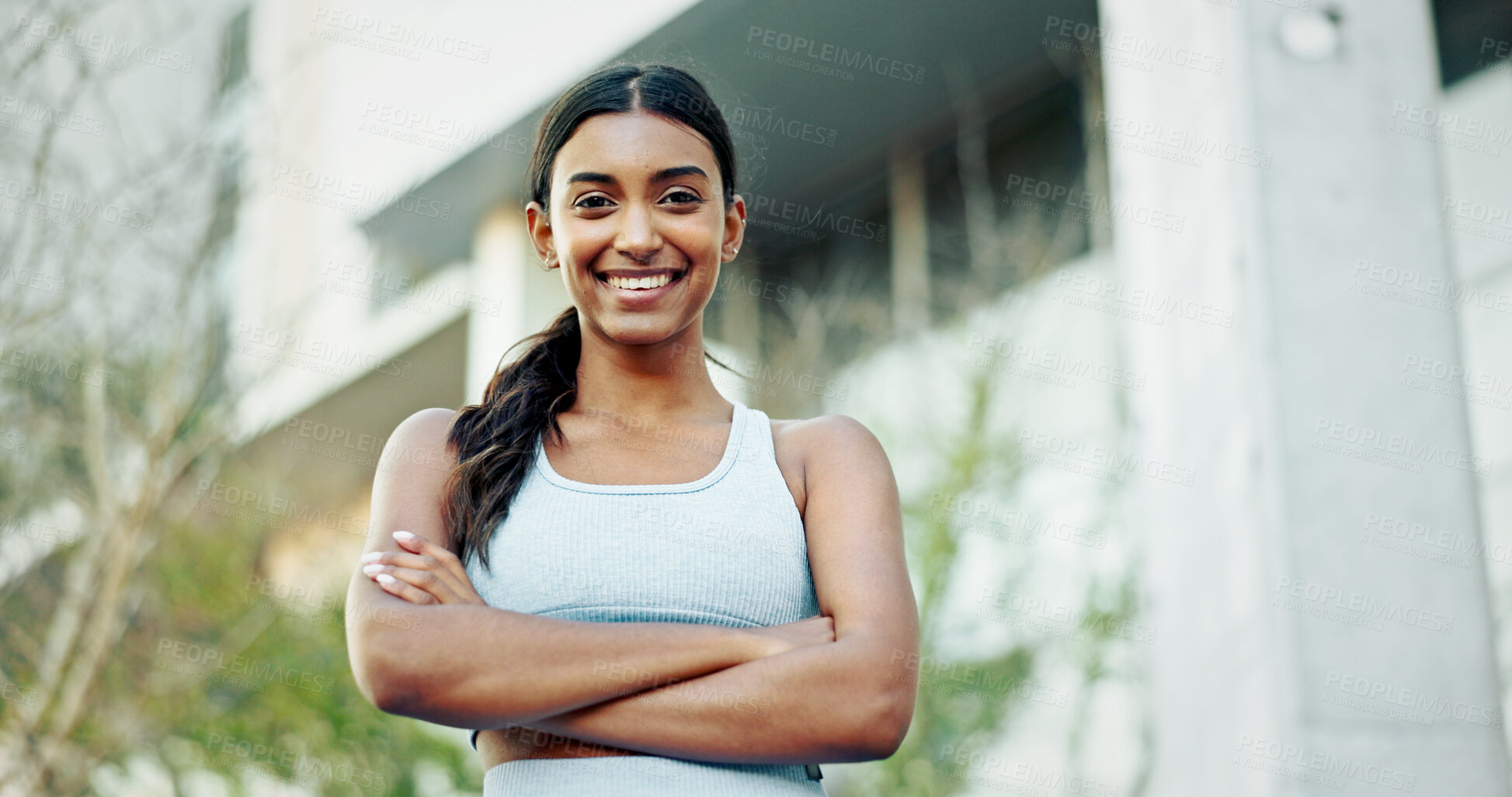 Buy stock photo Portrait, fitness and woman with arms crossed, outdoor and urban town with buildings, smile and exercise. Face, healthy athlete and person in street, training and wellness with workout and New York