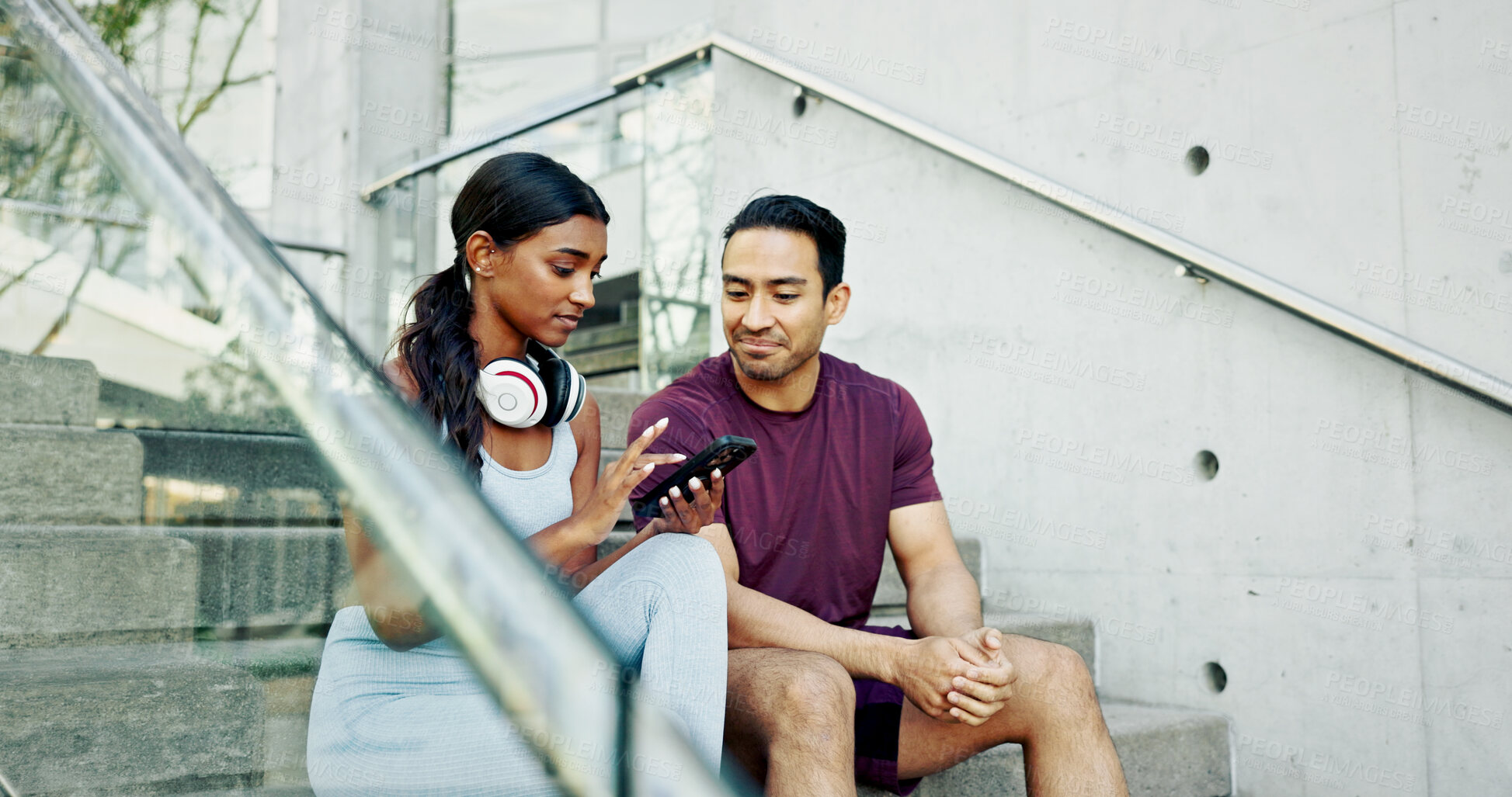 Buy stock photo Stairs, city and couple with phone, exercise break and smile for support or challenge in New York. Athlete, man and woman in urban town with health tracker, fitness or training for marathon endurance