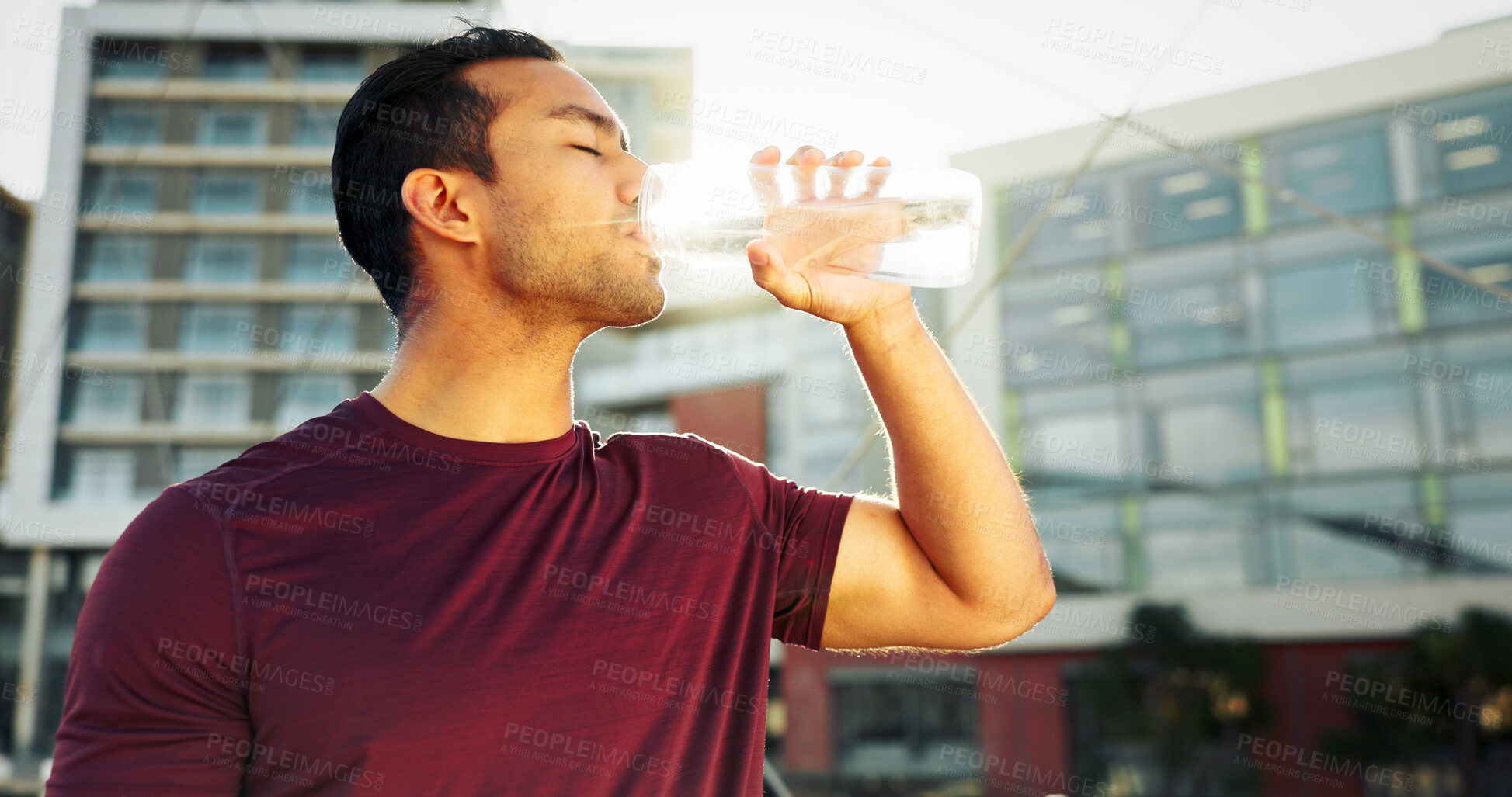Buy stock photo Man, drinking water and town athlete on break, liquid nutrition and sports drink for fitness. Male person, relax and bottle of h2o for refreshing rest in urban city, workout and exercise recovery