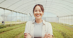 Happy, sustainable and portrait of woman in greenhouse for agriculture, eco friendly or natural produce. Crossed arms, environment and face of Asian female farmer for indoor gardening with vegetables