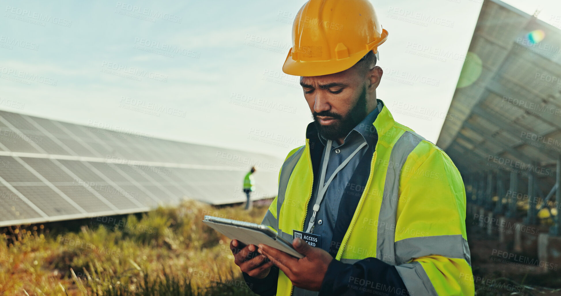 Buy stock photo Solar panel, outdoor and man with tablet, engineering and thinking with online reading. Inspector, employee and professional in field, technology or internet with digital app for maintenance schedule