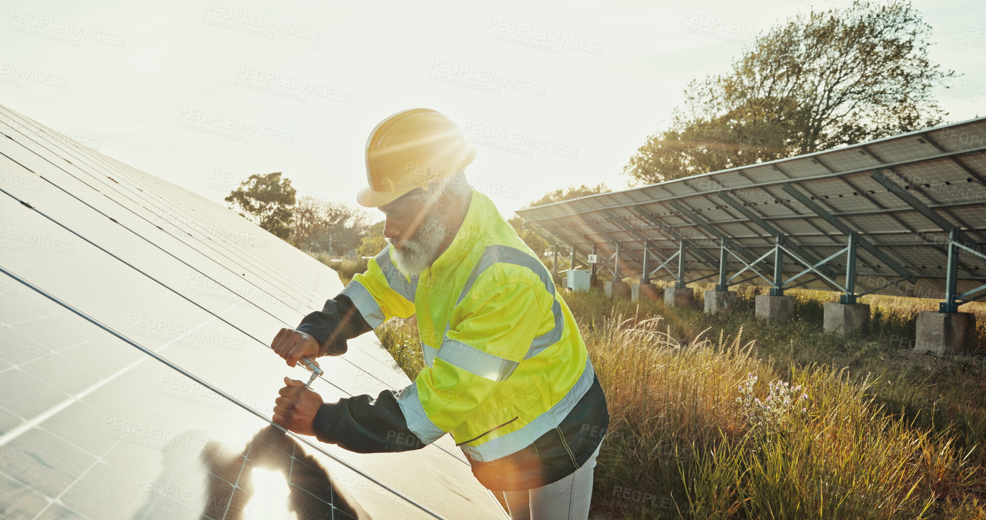 Buy stock photo Solar panels, install and grid with black man in nature for photovoltaic technician, renewable energy or power generator. Sustainability, electric system or engineer with person for maintenance