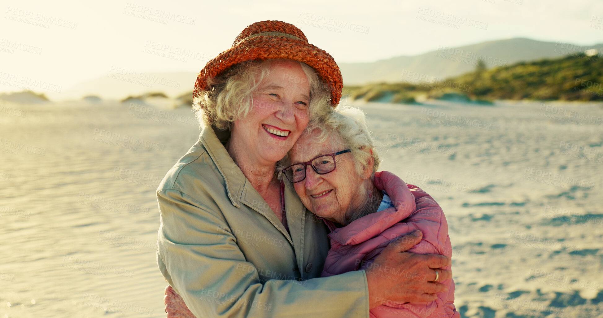 Buy stock photo Hug, friends and holiday with old women at beach for bonding, retirement and happiness. Summer vacation, travel trip and adventure with senior people in outdoors for carefree, paradise and health