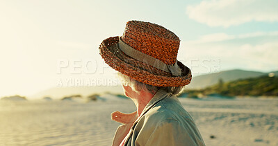 Buy stock photo Senior woman, hat and view on beach for travel adventure, sightseeing and exploring nature in retirement. Back, elderly person and relax by ocean for fresh air, wellness and holiday break on weekend