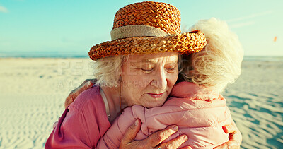 Buy stock photo Hug, friends and love with old women at beach for bonding, retirement and support. Summer vacation, travel trip and adventure with senior people in outdoors for carefree, paradise and health
