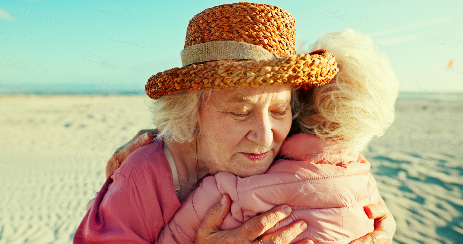 Buy stock photo Hug, friends and love with old women at beach for bonding, retirement and support. Summer vacation, travel trip and adventure with senior people in outdoors for carefree, paradise and health
