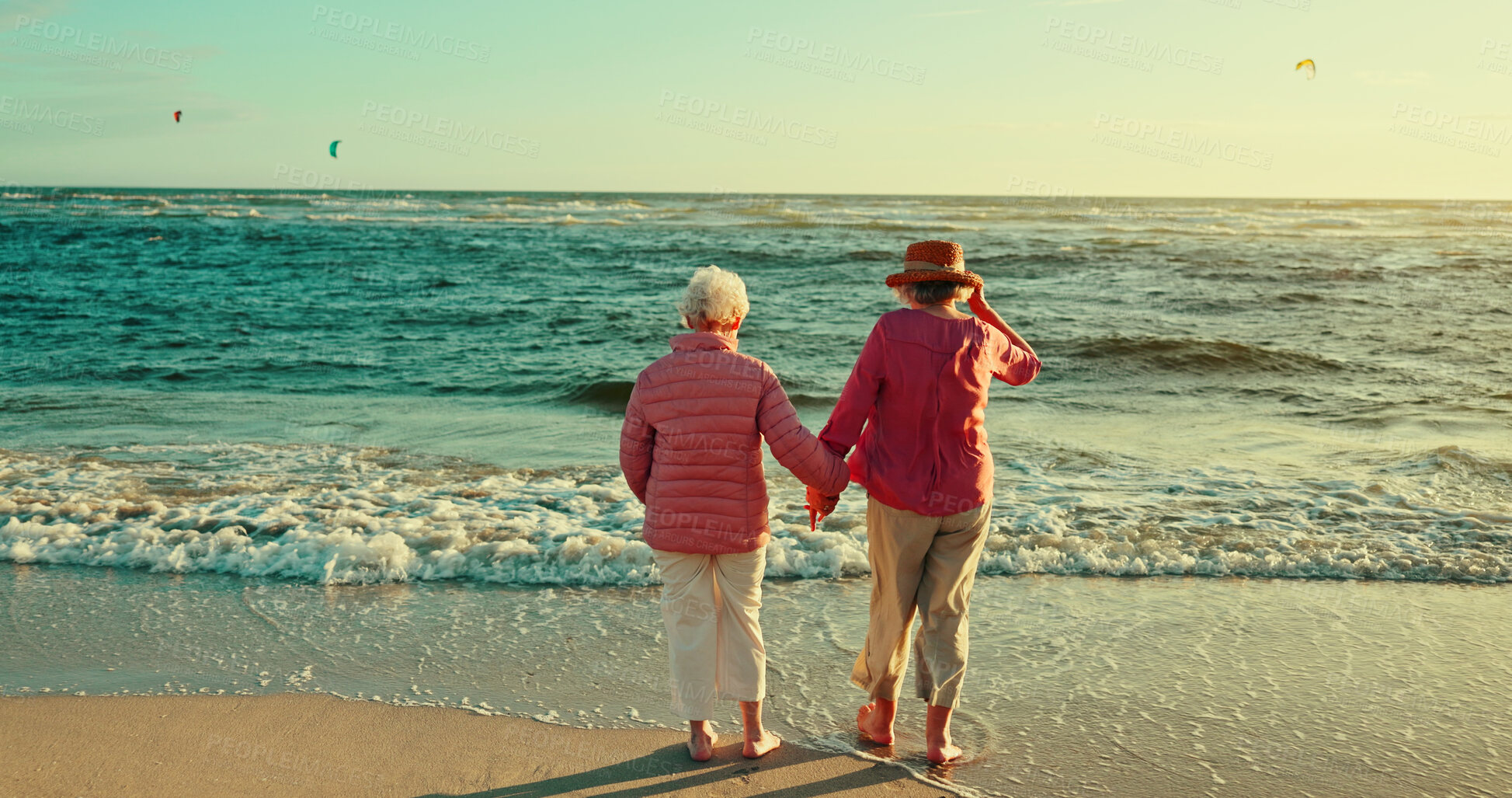 Buy stock photo Holding hands, friends and waves with old women at beach for bonding, retirement and happiness. Summer vacation, travel trip and adventure with back of senior people for carefree, paradise and health