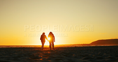 Buy stock photo Sunset, holding hands and travel with old women at beach for summer vacation, retirement and happiness. Holiday, bonding and tourism with back of senior people for friends, adventure and mockup space