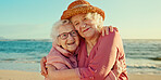 Hug, friends and care with old women at beach for bonding, retirement and happiness. Summer vacation, travel trip and adventure with senior people in outdoors for carefree, paradise and health
