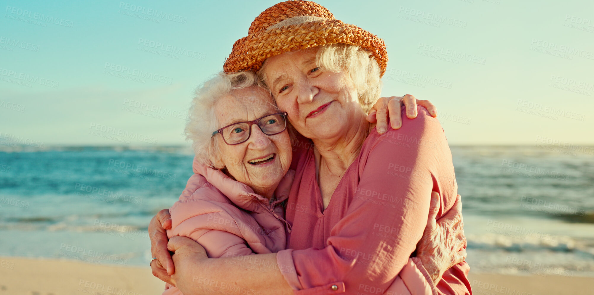 Buy stock photo Hug, friends and care with old women at beach for bonding, retirement and happiness. Summer vacation, travel trip and adventure with senior people in outdoors for carefree, paradise and health
