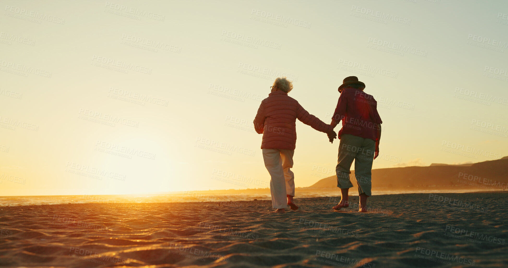 Buy stock photo Sunset, holding hands and back with old women at beach for summer vacation, retirement and happiness. Holiday, bonding and tourism with senior people for friends, travel adventure and mockup space
