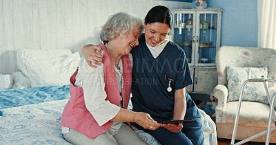 Buy stock photo Happy, senior woman and caregiver with tablet in bedroom for medical report, wellness news and healthcare. Elderly person, volunteer and hug for digital app, insurance update and information at house