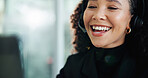 Woman, call center and laughing with headset, happy and listen for customer service in office. Person, consultant or agent with problem solving, microphone or voip connection for support at help desk