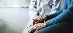 Holding hands, doctor and patient with compassion, consultation or advice with healthcare in clinic. Closeup, help or medical with comfort, sympathy or review for diagnosis or empathy with people