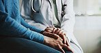 Holding hands, doctor and patient with comfort, compassion and advice with results in clinic. Closeup, help and medical with sympathy, consultation or review for diagnosis, healthcare and empathy