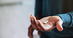 Person, hands and patient with pills for medication, pain relief or prescription at home. Closeup, pharmaceuticals or tablets with consumer for healthcare dosage, symptoms or medical cure at house