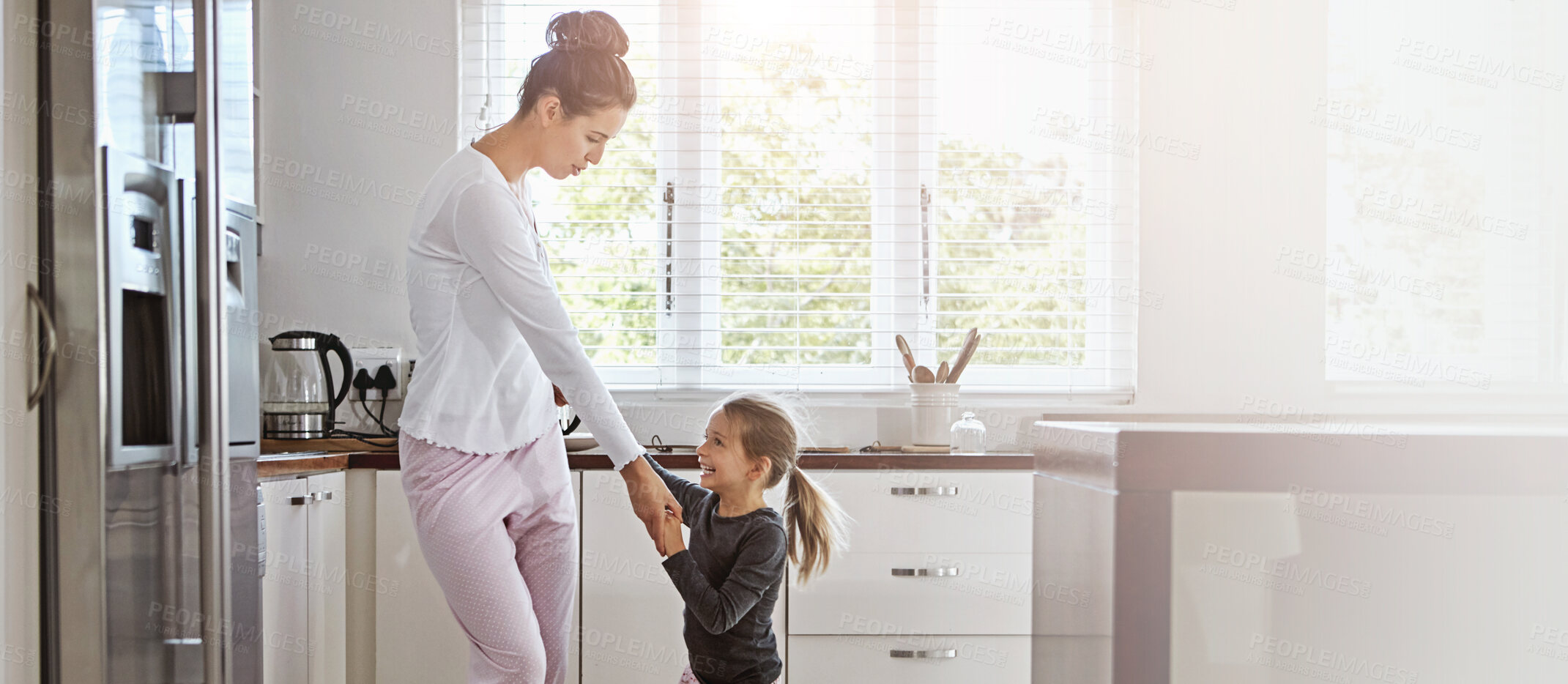 Buy stock photo House, dancing and mother in kitchen, girl and bonding together with happiness. Parent, apartment and mama with daughter, kid and music with movement, energy and cheerful with break, funny and joyful