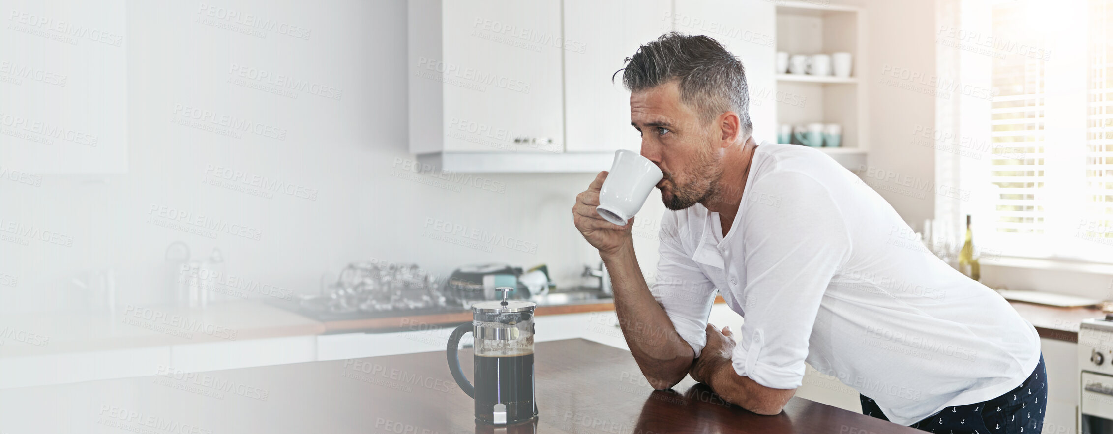 Buy stock photo Kitchen, man and thinking with drinking coffee on counter in morning with ideas and daydreaming at home. Male person, banner and mock space with cup of tea as warm beverage to relax, rest and calm