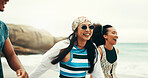 Excited, friends and walking on beach outdoor for travel reunion, summer vacation and laugh of funny joke. Smile, people and sunglasses for holiday journey, social gathering and weekend trip at ocean