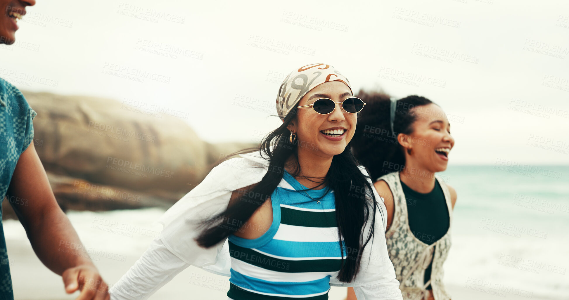 Buy stock photo Excited, friends and walking on beach outdoor for travel reunion, summer vacation and laugh of funny joke. Smile, people and sunglasses for holiday journey, social gathering and weekend trip at ocean