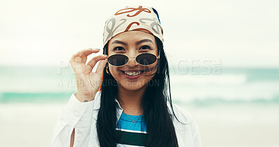 Buy stock photo Portrait, beach and woman with sunglasses, smile and fashion for holiday, adventure or summer vacation. Happy, travel and person with shades, ocean and confidence with weekend trip to Miami sea