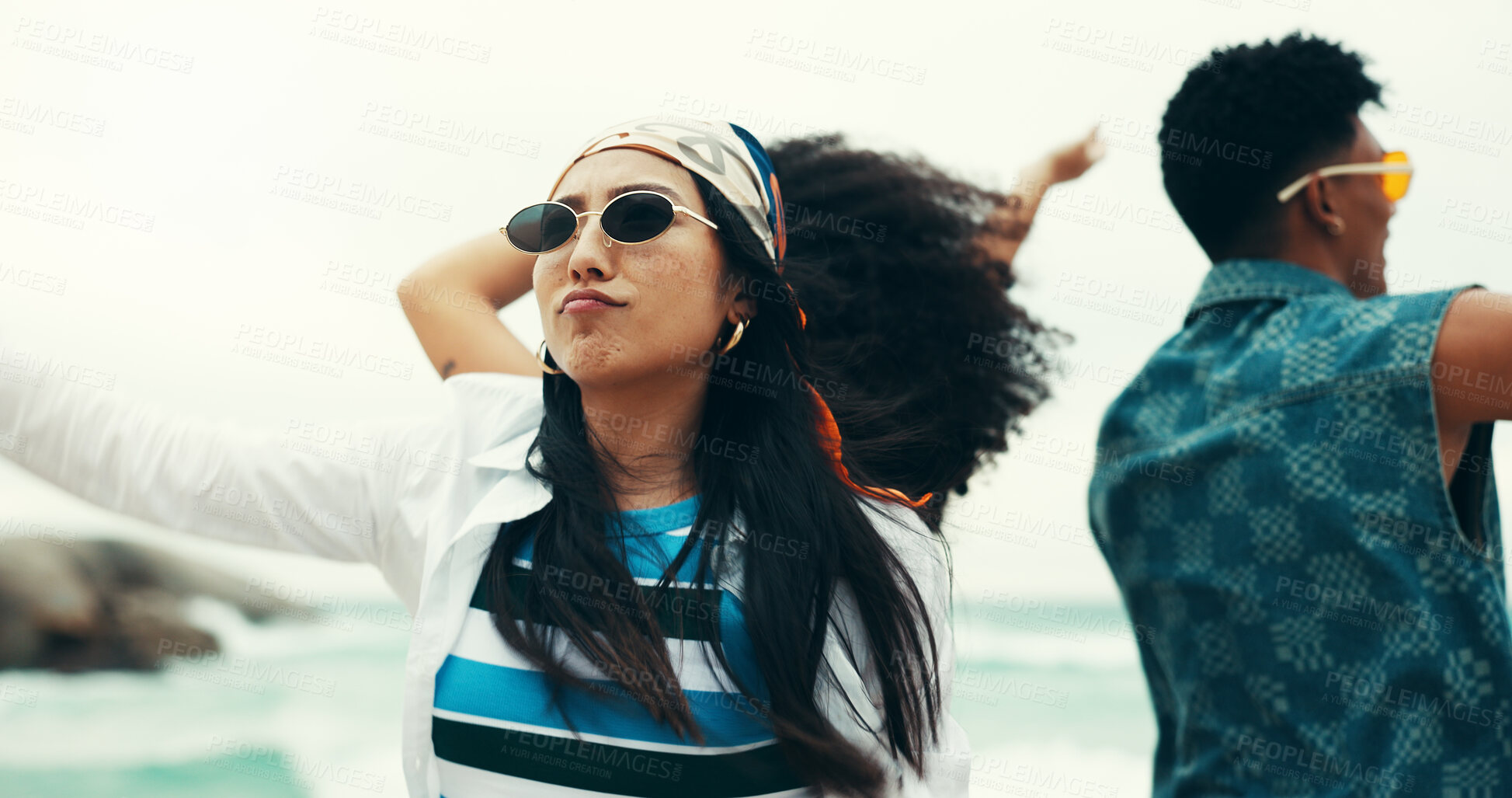 Buy stock photo Woman, friends and dancing on beach outdoor with energy, movement and vacation reunion for rave festival. Group, people and rhythm at island party, summer freedom and bonding together of travel trip 