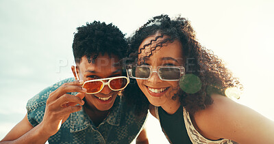 Buy stock photo Happy friends, portrait and sunglasses with fashion for holiday, weekend or summer vacation on beach. People, friendship or smile with shades for style, sunshine or outdoor adventure by ocean coast