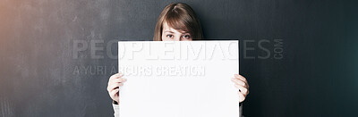 Buy stock photo Studio, empty and person with poster, sign and activist with opinion, presentation and announcement. Banner, portrait and woman with message on paper, grey background and display of mockup space