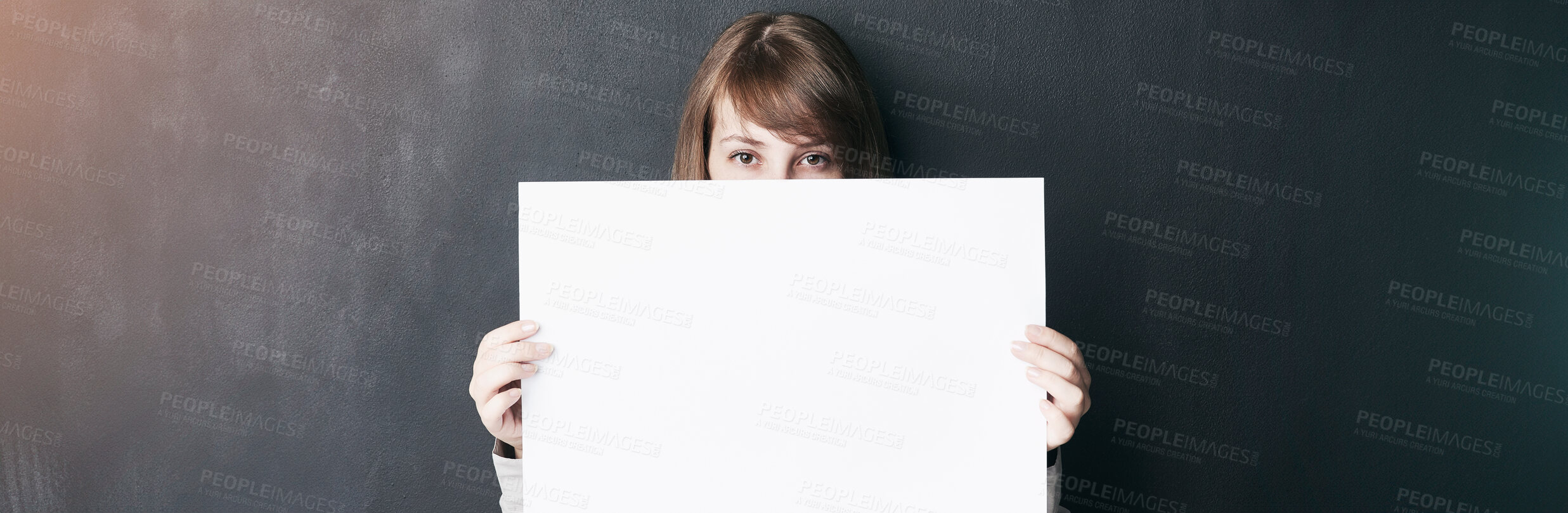 Buy stock photo Studio, empty and person with poster, sign and activist with opinion, presentation and announcement. Banner, portrait and woman with message on paper, grey background and display of mockup space